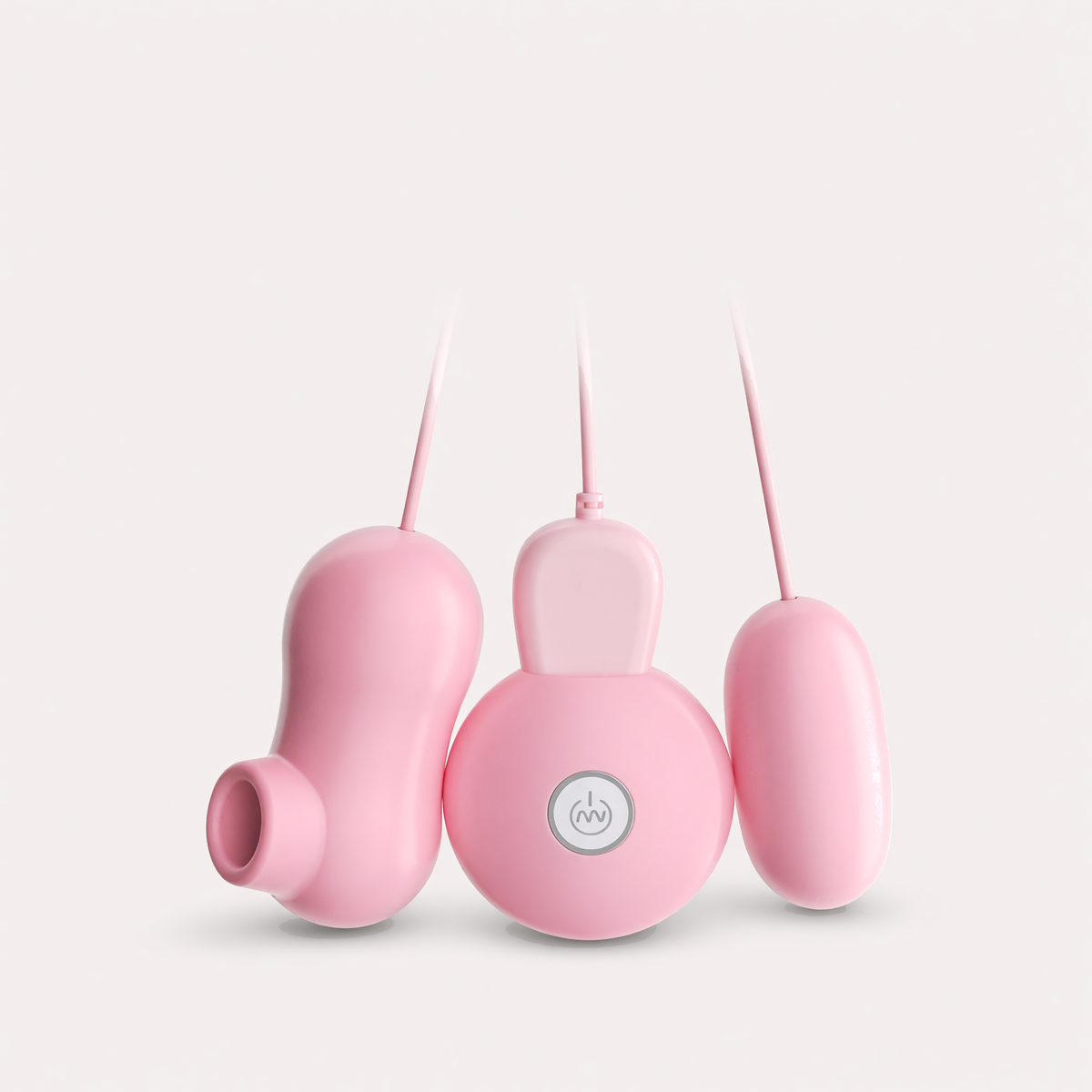 Jugalbandi set front view: suction massager, handheld remote and egg in soft pink