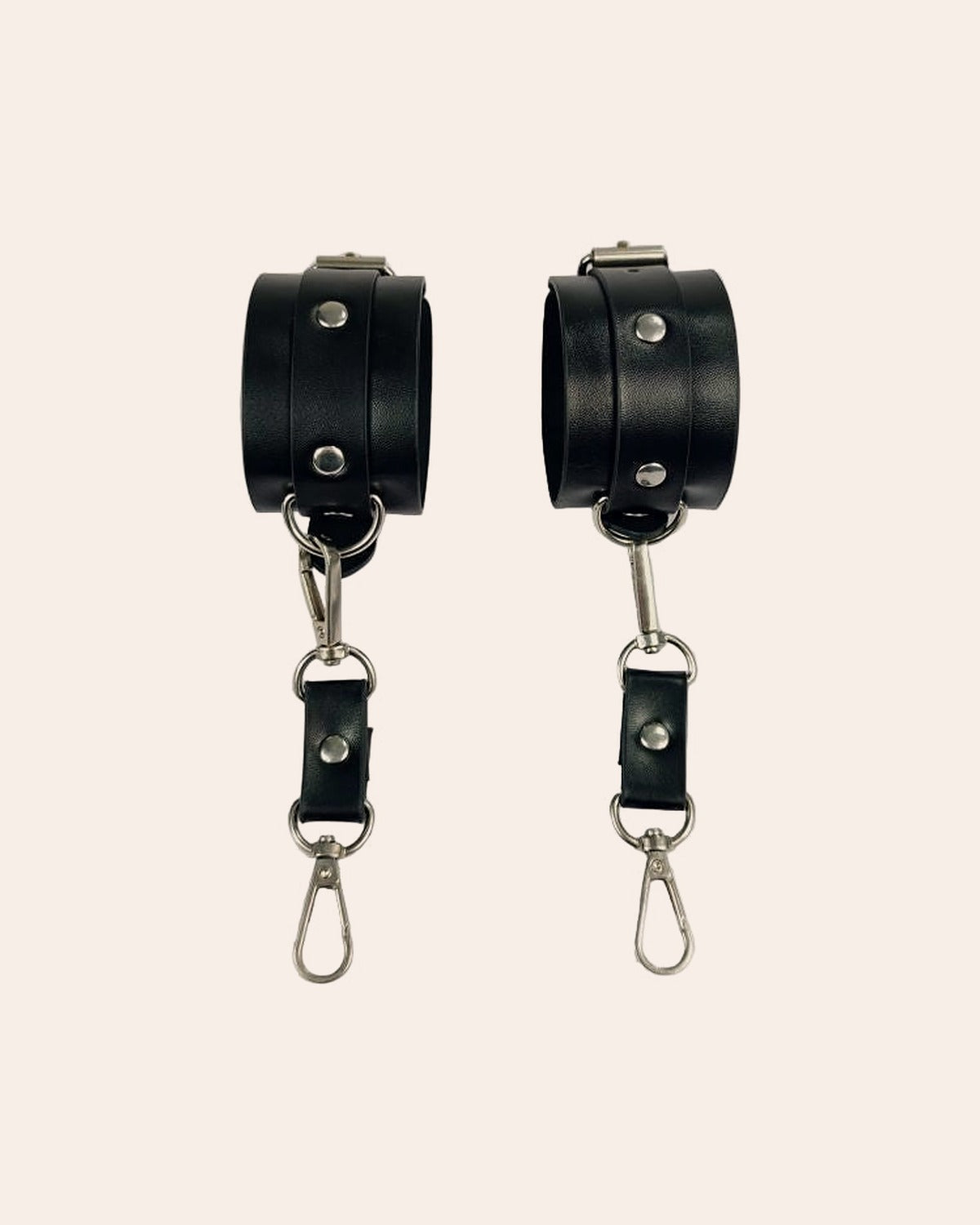 Qaid wide faux-leather cuffs with studs and buckle, side view