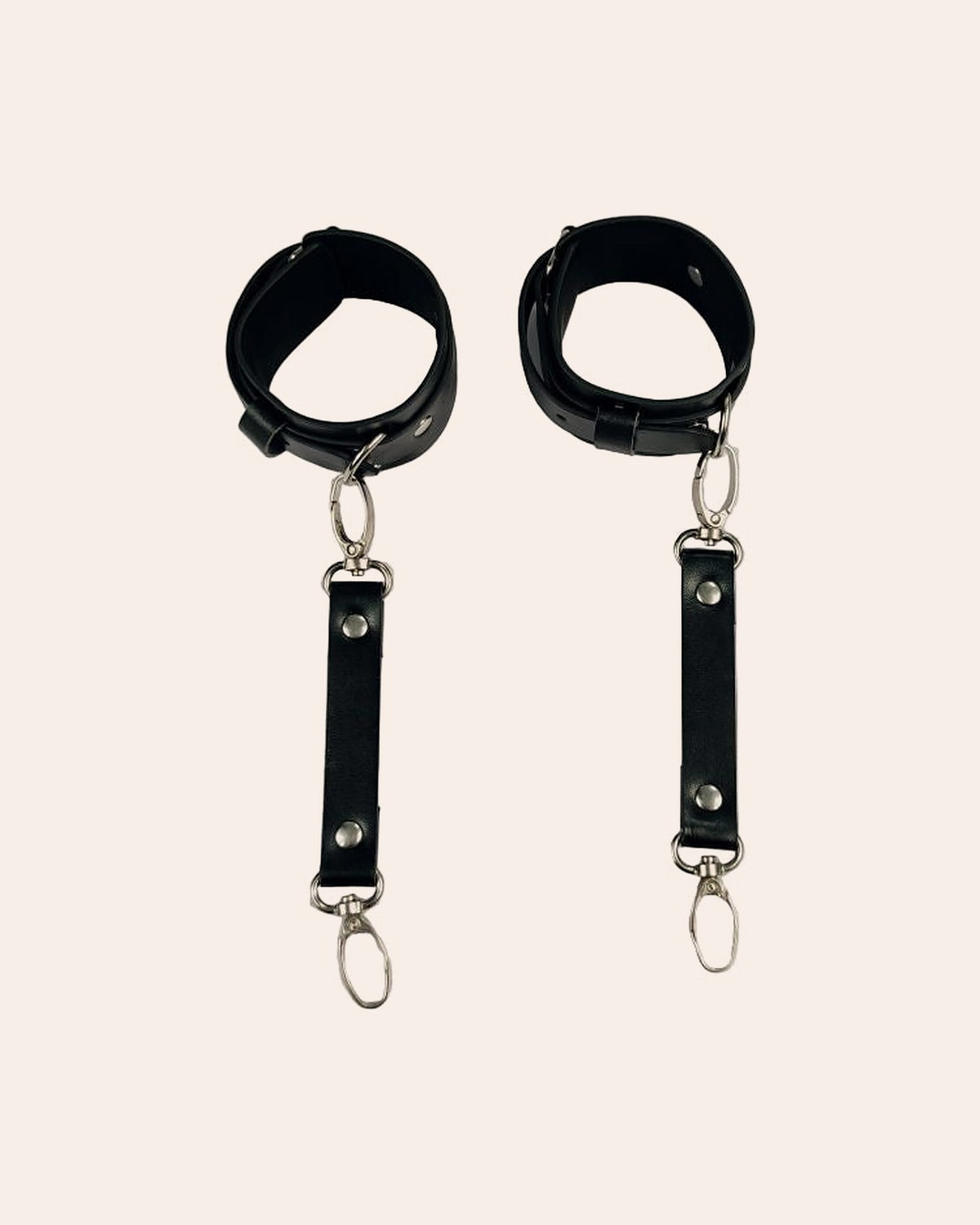 Qaid pair of black wrist cuffs, front view